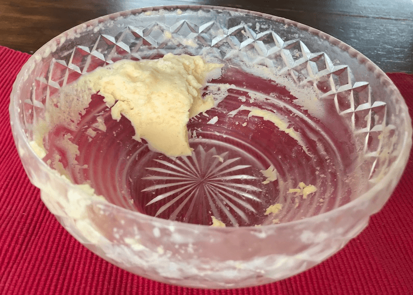 A cut-glass pudding bowl with a skerrick of creamy pudding left. 