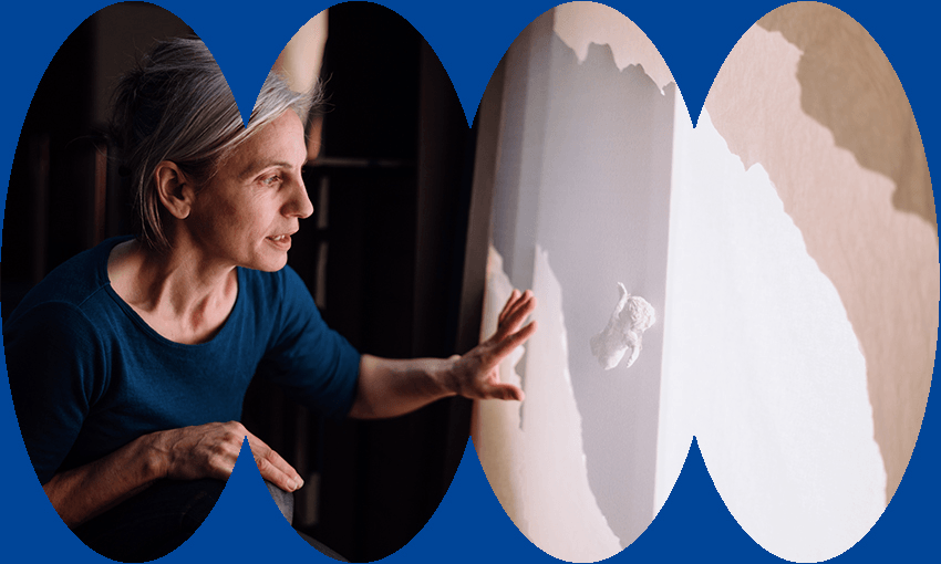 Artist Kate Parker looks at one of the light box installations at I Am Island and Sea (Image: Supplied) 
