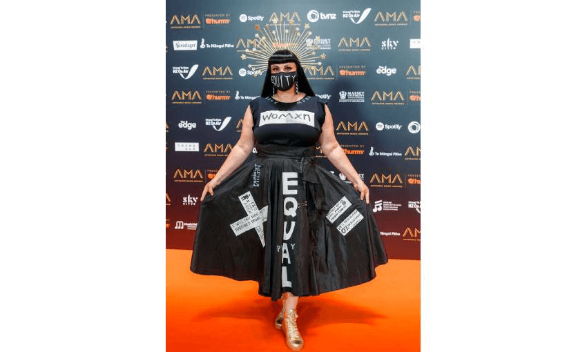 Tami Neilson at the 2021 Aotearoa Music Awards wearing a black dress emblazoned with "equality" and feminist imagery.