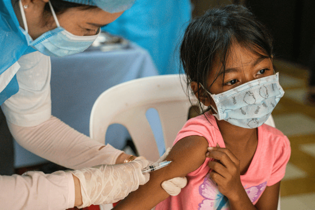 A child receives the Covid vaccine on September 18, 2021 in Phnom Penh, Cambodia. (Photo: Cindy Liu/Getty Images) 
