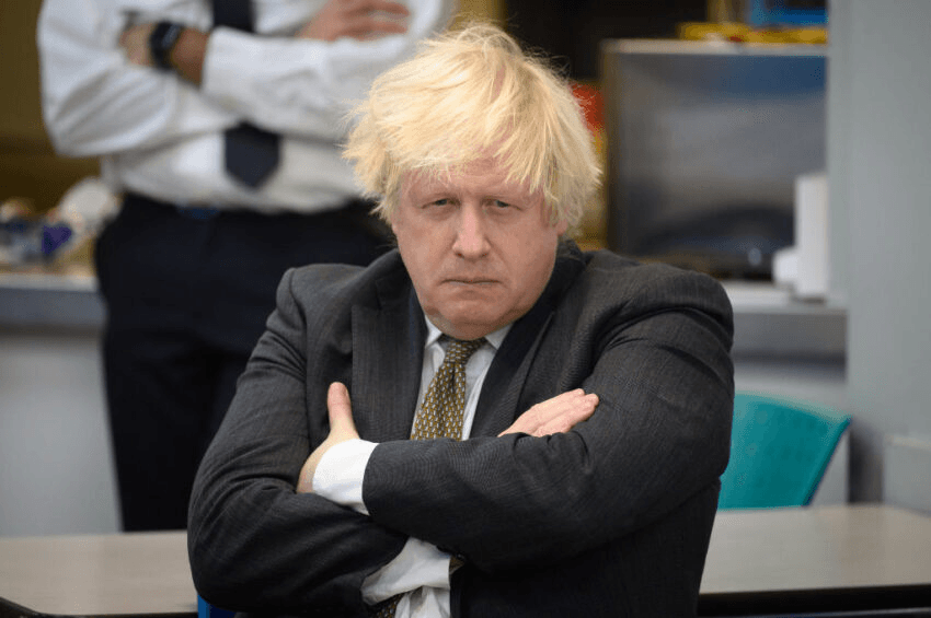 UXBRIDGE, ENGLAND – DECEMBER 17: Britain’s Prime Minster Boris Johnson speaks with members of the Metropolitan Police in their break room, as he makes a constituency visit to Uxbridge police station on December 17, 2021 in Uxbridge, England. (Photo by Leon Neal/Getty Images) 
