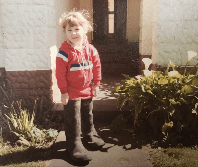 Small girl in a pair of giant gummies. 