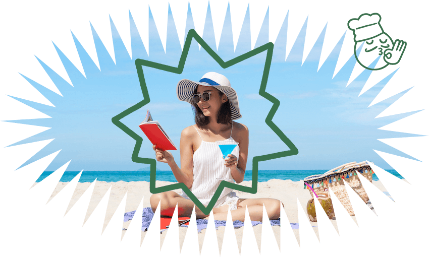 Woman ecstatically reading on beach - she's sitting cross-legged, wearing a giant hat, holding a book in one hand and cocktail in the other.