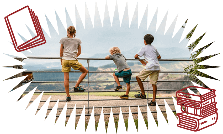 Three children have climbed a farm gate and look wistfully into the distance, all elbows and knees. We see them from behind. Illustrations of books surround them.