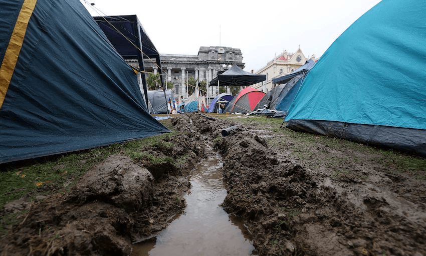 Trenches dug to channel water after the speaker of parliament ordered the sprinklers to be turned on all night in the grounds of parliament (Photo: MARTY MELVILLE/AFP via Getty Images) 
