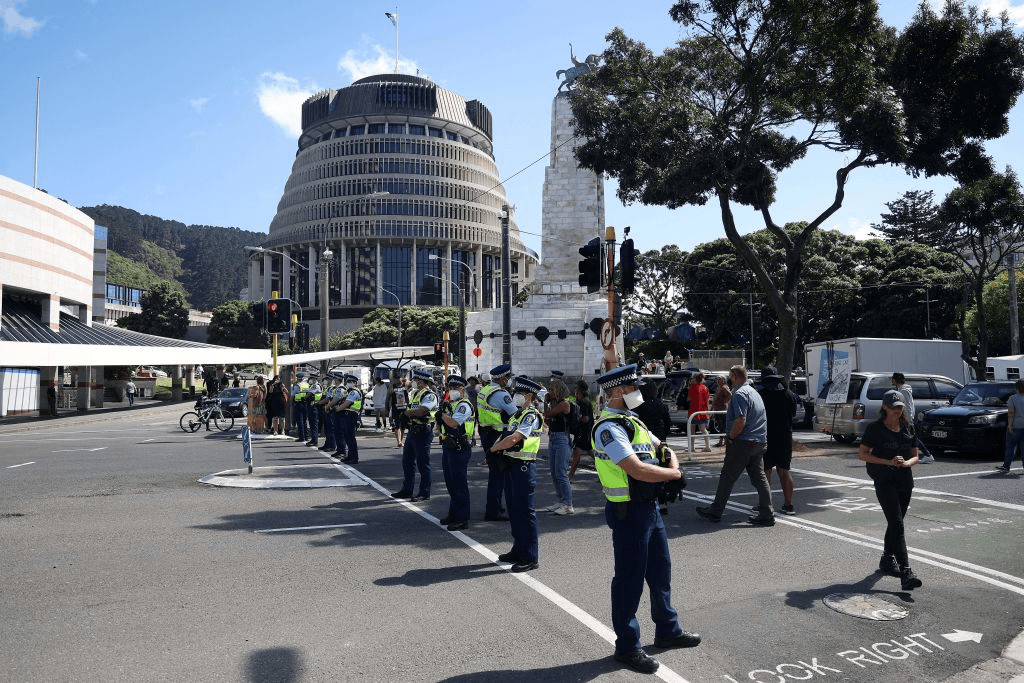 Police take over an intersection leading to Parliament on the ninth day of demonstrations against Covid-19 restrictions in Wellington on February 16, 2022, inspired by a similar demonstration in Canada. (Photo by Marty MELVILLE / AFP) (Photo by MARTY MELVILLE/AFP via Getty Images) 
