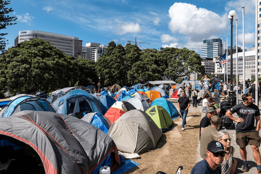 Tents of demonstrators outside the Parliament building in Wellington, New Zealand, on Friday, Feb. 18, 2022. The protest against vaccine mandates in front of New Zealand’s parliament, now in its 11th day, has grown in size and shows no signs of abating, posing a headache for authorities just as the country’s omicron outbreak begins to surge. Photographer: Birgit Krippner/Bloomberg 
