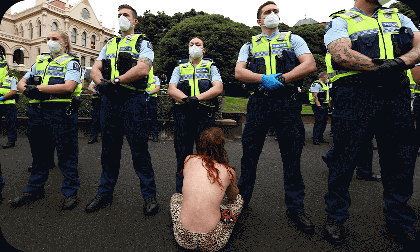 A woman sits in front of police before they moved in to evict protesters in parliament grounds, February 10, 2022 (Photo by MARTY MELVILLE/AFP via Getty Images; additional design by Tina Tiller) 
