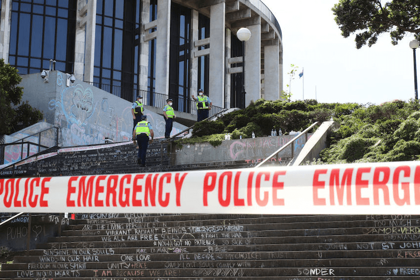 WELLINGTON, NEW ZEALAND – MARCH 3: Police officers climb the graffiti covered steps to the Beehive inside the cordoned off area of Wellington city around Parliament buildings as the clean up continues on March 03, 2022 in Wellington, New Zealand. Police broke up the anti-COVID-19 mandate protester encampment yesterday after weeks of conflict in the …  Read more 
