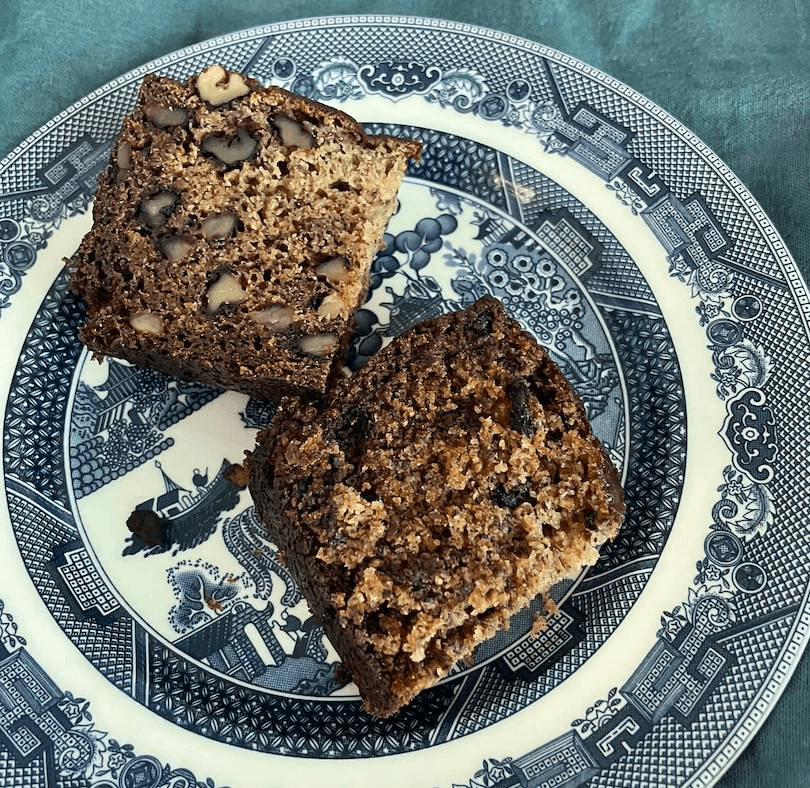 Two slices of banana cake on a pretty plate.