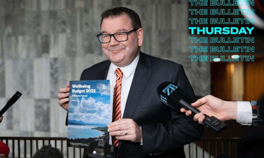 Grant Robertson with budget cover featuring photo he took himself (Photo: RNZ/Angus Dreaver) 
