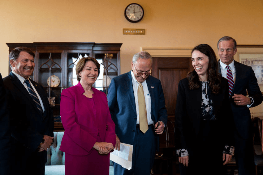 WASHINGTON, DC – MAY 25: Prime Minister of New Zealand Jacinda Ardern, second from right, chats with (L-R) Sen. Mike Rounds (R-SD), Sen. Amy Klobuchar (D-MN), Senate Majority Leader Charles Schumer (D-NY) and Senate Minority Whip John Thune (R-SD) on Capitol Hill on Wednesday, May 25, 2022 in Washington, DC.  (Kent Nishimura / Los Angeles Times via Getty Images) 
