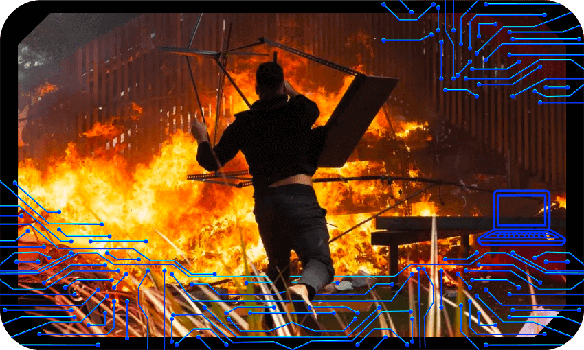 A fire burns on the final day of the parliament occupation (Photo: Marty Melville / AFP via Getty Images; design by Tina Tiller) 
