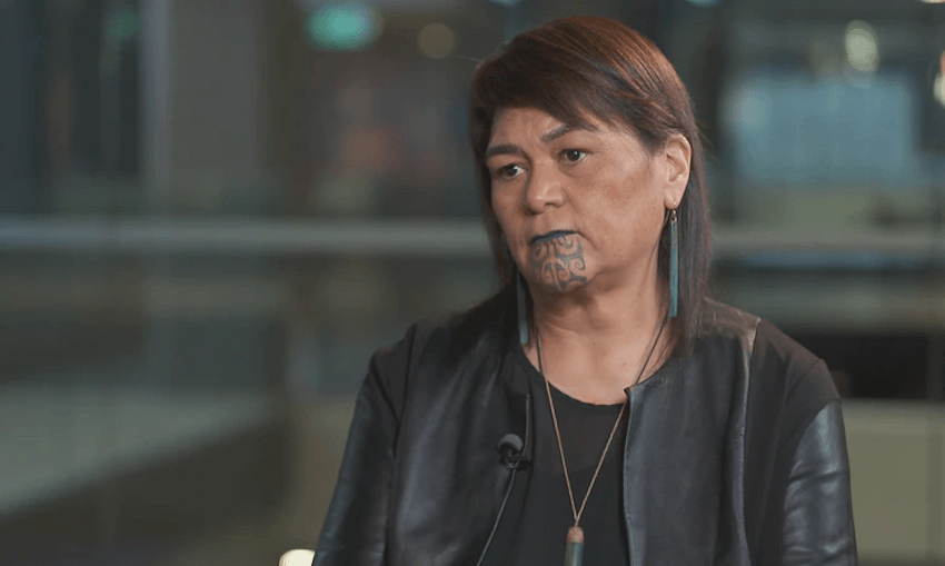 Nanaia Mahuta being interviewed. She's wearing a black shirt and black leather jacket