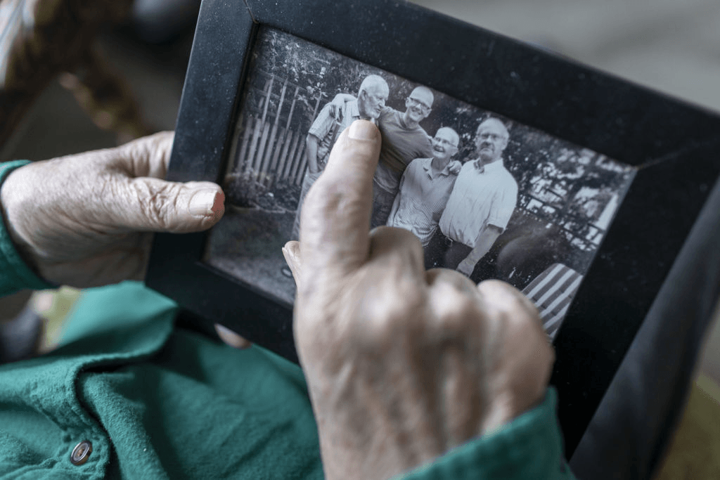 HEIDELBERG, GERMANY - MARCH 30: In this photo illustration a Old man has a family photo in his hands on March 30, 2022 in Heidelberg, Germany. (Photo Illustration by Ute Grabowsky/Getty Images)