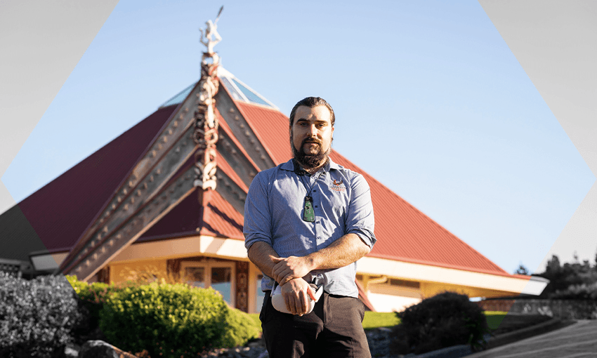 Rory Clifford stands outside Te Rau Aroha marae (Image: Maija Stephens) 
