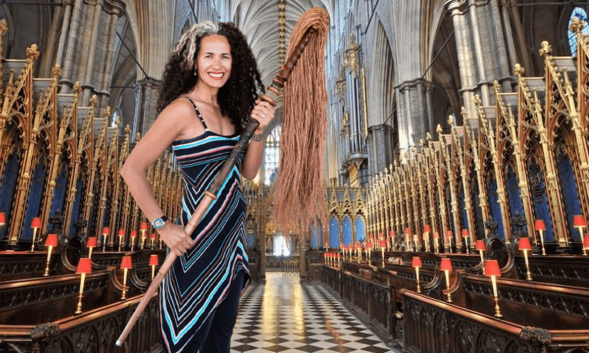 Poet Selina Tusitala Marsh with her own orator’s tokotoko, topped with a Sāmoan fue, or fly whisk.  
