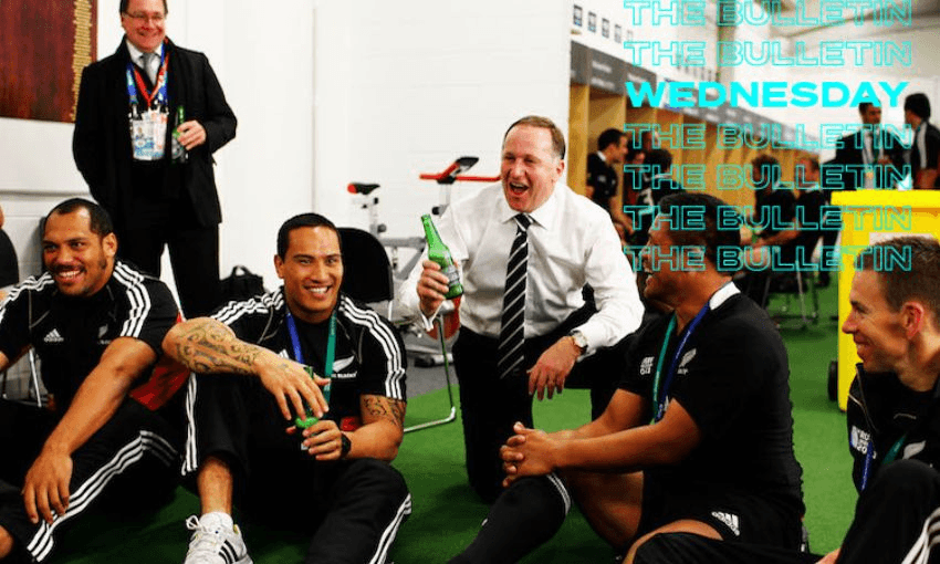 John Key celebrates with a beer and the All Blacks in 2011 after their win over France, a country that banned alcohol advertising on television in 1991 (Image: Getty)