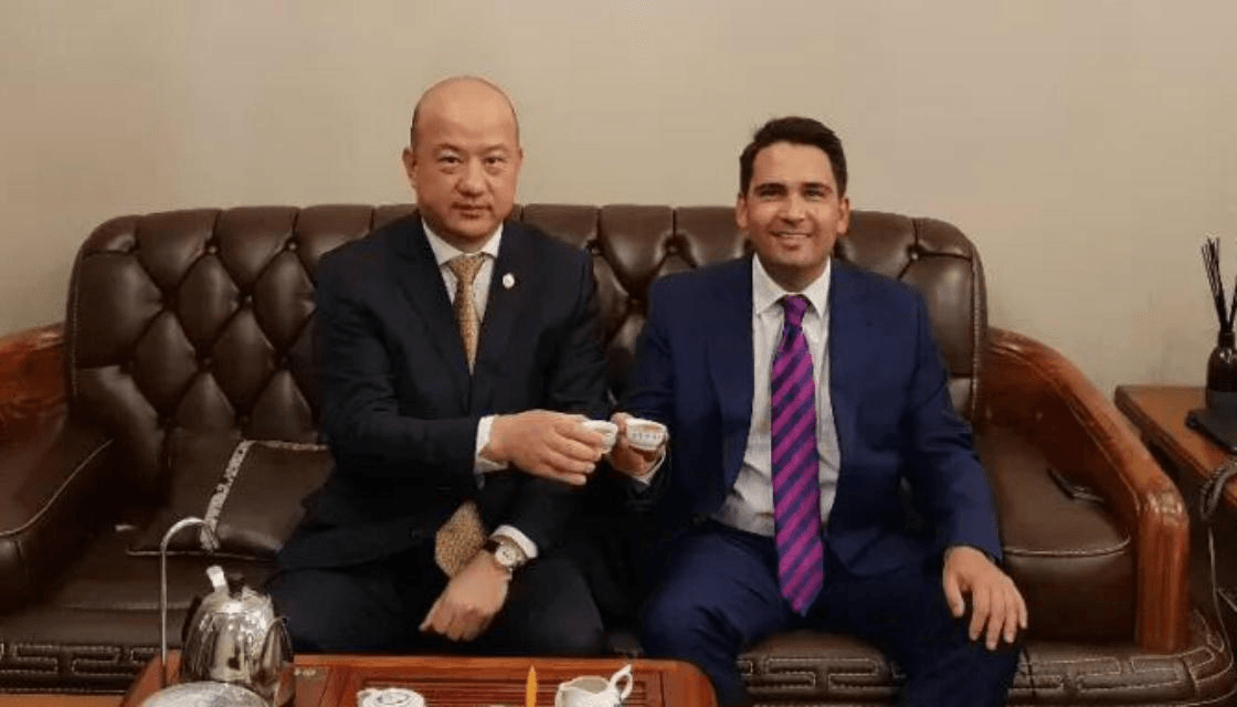 Yikun Zhang, pictured in this file photo with former National leader Simon Bridges, has been found guilty in relation to a donation to the National Party.  
