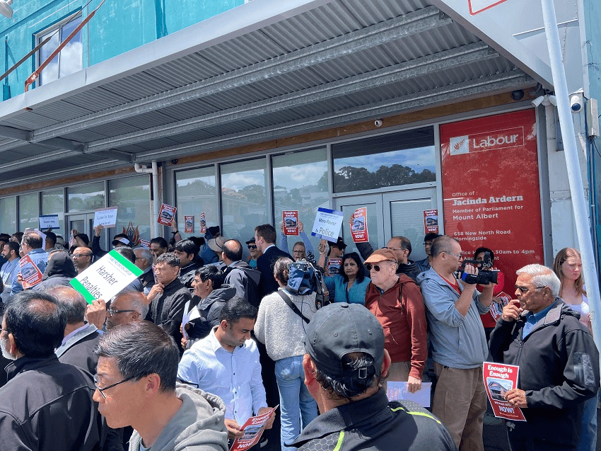 a crowd of protesters outside a labour office
