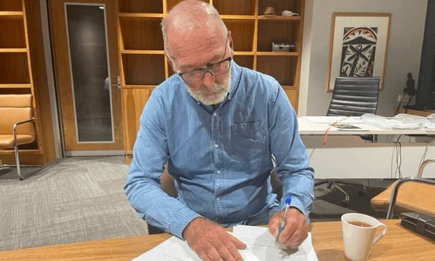 Wayne Brown signing the state of emergency declaration, in a photograph provided by the mayor’s office. 
