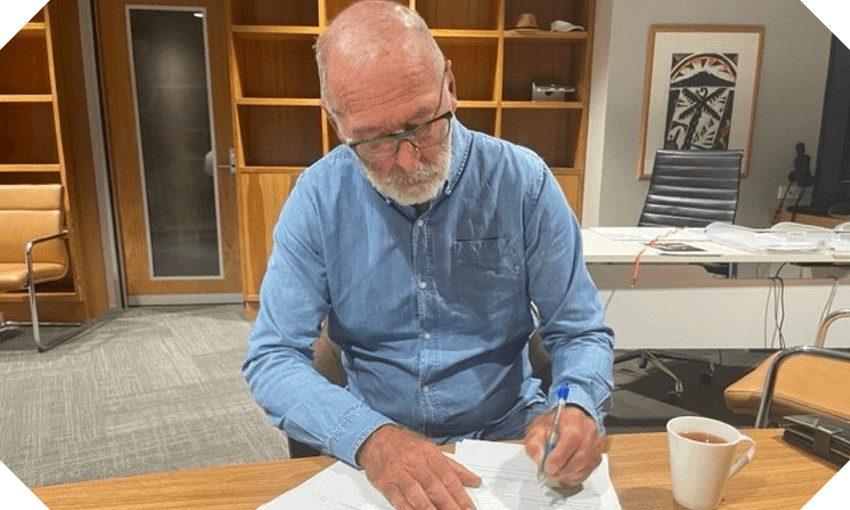 Wayne Brown signing the state of emergency declaration, in a photograph provided by the mayor’s office. 
