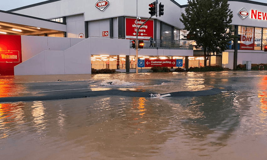 a new world supermarket surrounded by brown water