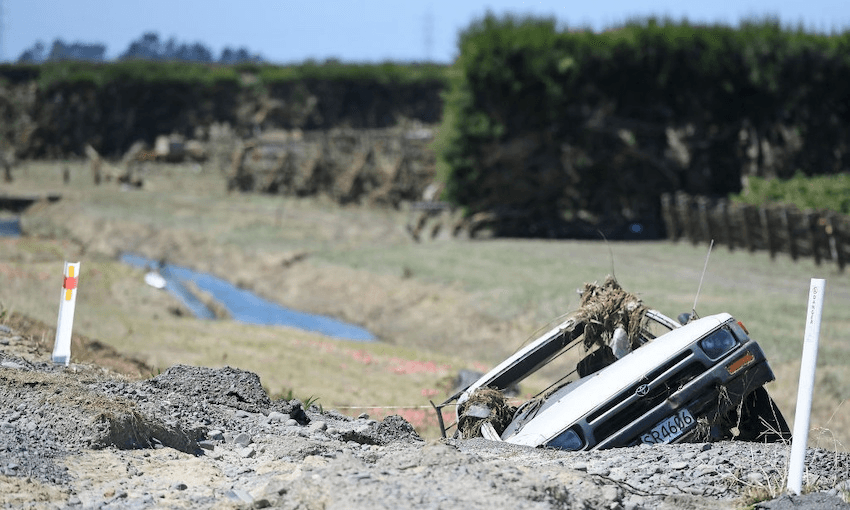 A car is submerged in flood damage in Korokipo Road, Napier. (Photo: Getty Images) 
