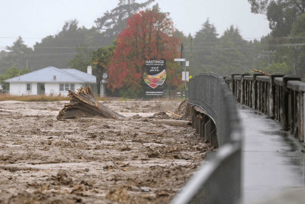Redcliffe Bridge is closed off as debris piles up along the Tutaekuri River in the suburb of Taradale, February 15, 2023. . Photo: Getty Images 
