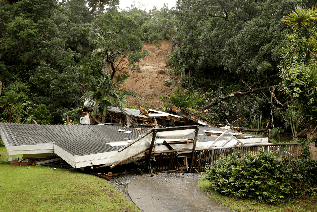 A home flattened by a slip in Muriwai. Photo: Getty 
