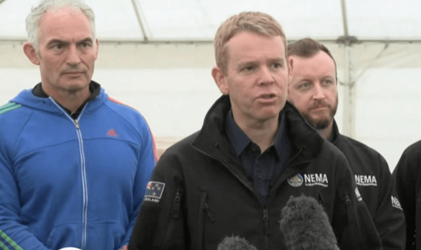 PM Chris Hipkins, flanked by ministers Stuart Nash and Kieran McAnulty, speaks to media in Hawke’s Bay 
