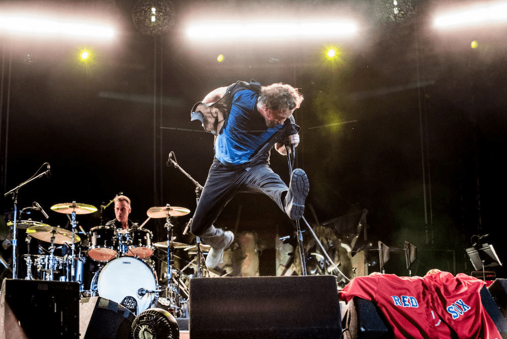 Eddie Vedder jumps as Pearl Jam live in Boston.