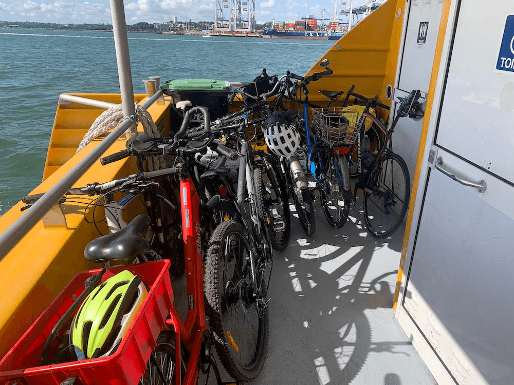 A common sight for cyclist-ferry commuters, not enough accommodation for bikes.