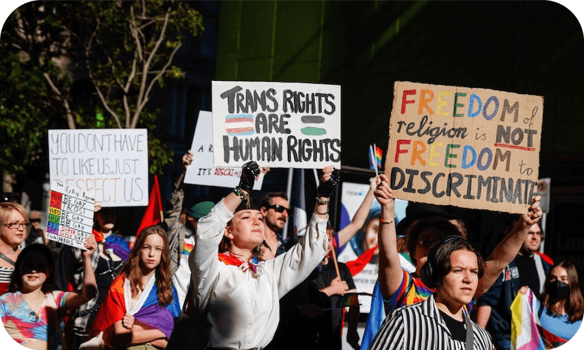 Protesters hold placards during a march through Brisbane. (Photo: Joshua Prieto/SOPA Images/LightRocket via Getty Images) 
