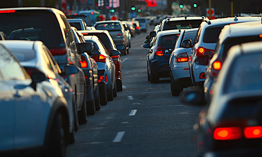 two lanes of rush hour traffic at sunset