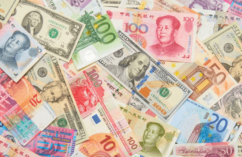 A pile of international currencies.