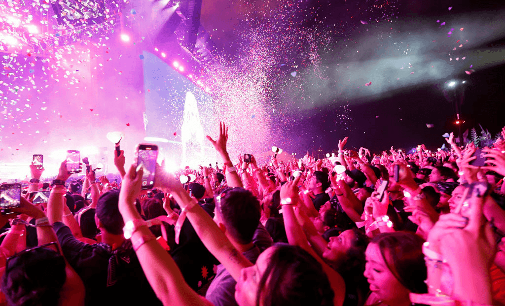 Fans in the crowd watch Blankpink play at Coachella.