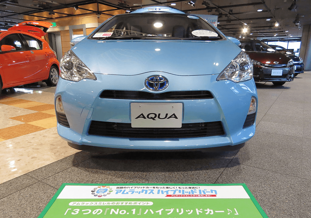 A blue Toyota Aqua