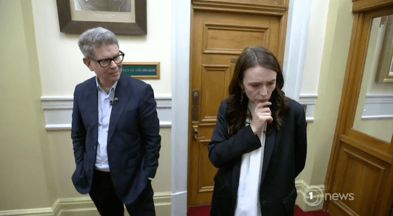 John Campbell and Jacinda Ardern stand together talking