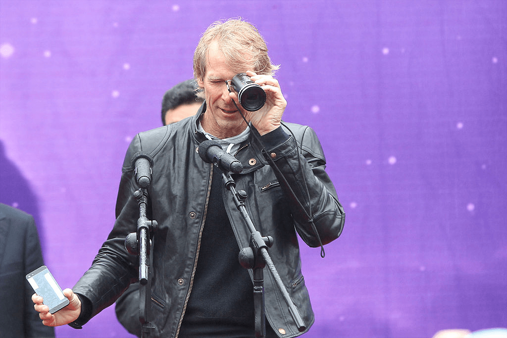 Michael Bay, the director of Transformers 2, poses with a lens.