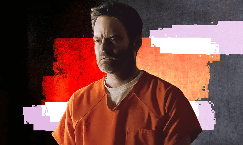 A man in an orange police jumpsuit sits in jail looking worried.