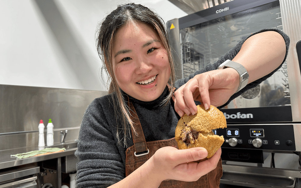 A mochi-infused cookie is pulled apart by Cathy Fan.