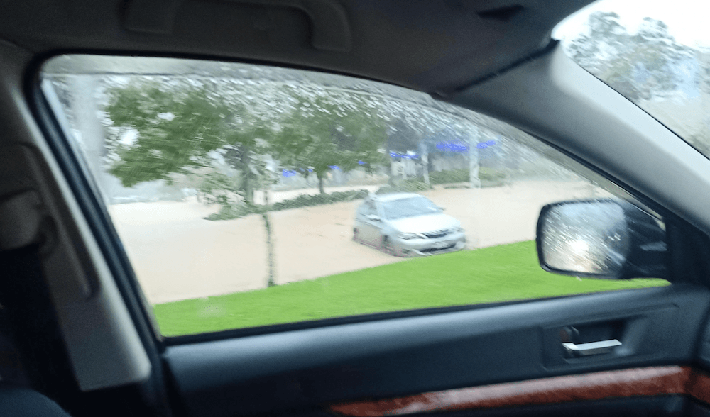 A photo taken from a car showing flooding in Henderson.