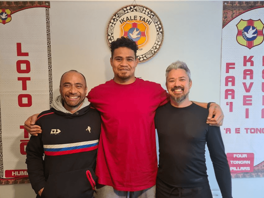 Charles Riechelmann on the left and Sebastian Hurrell on the right with an Ikale Tahi rugby player