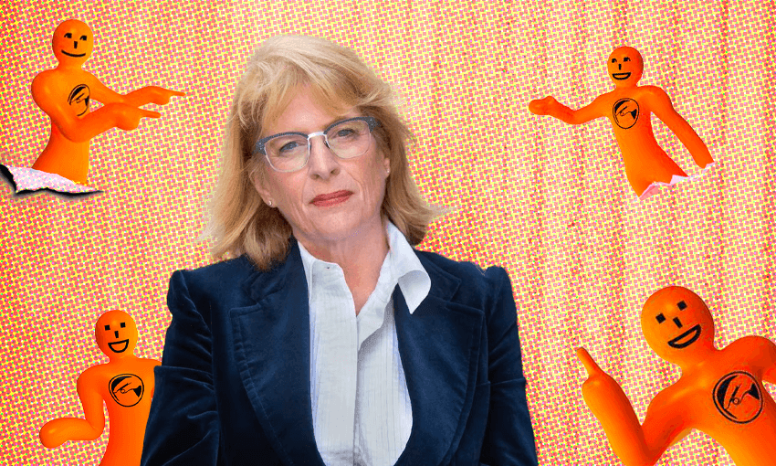 a white blonde woman in formal business dress surrounded by 'orange guy' mascots