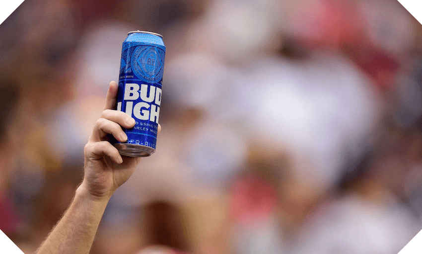 A sports fan holding a can of Bud Light beer (Photo: Getty Images) 
