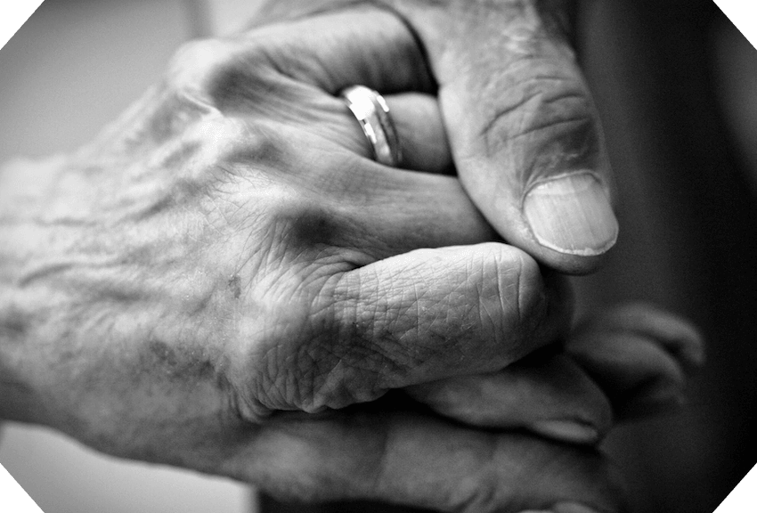 black and white photo of hands holding