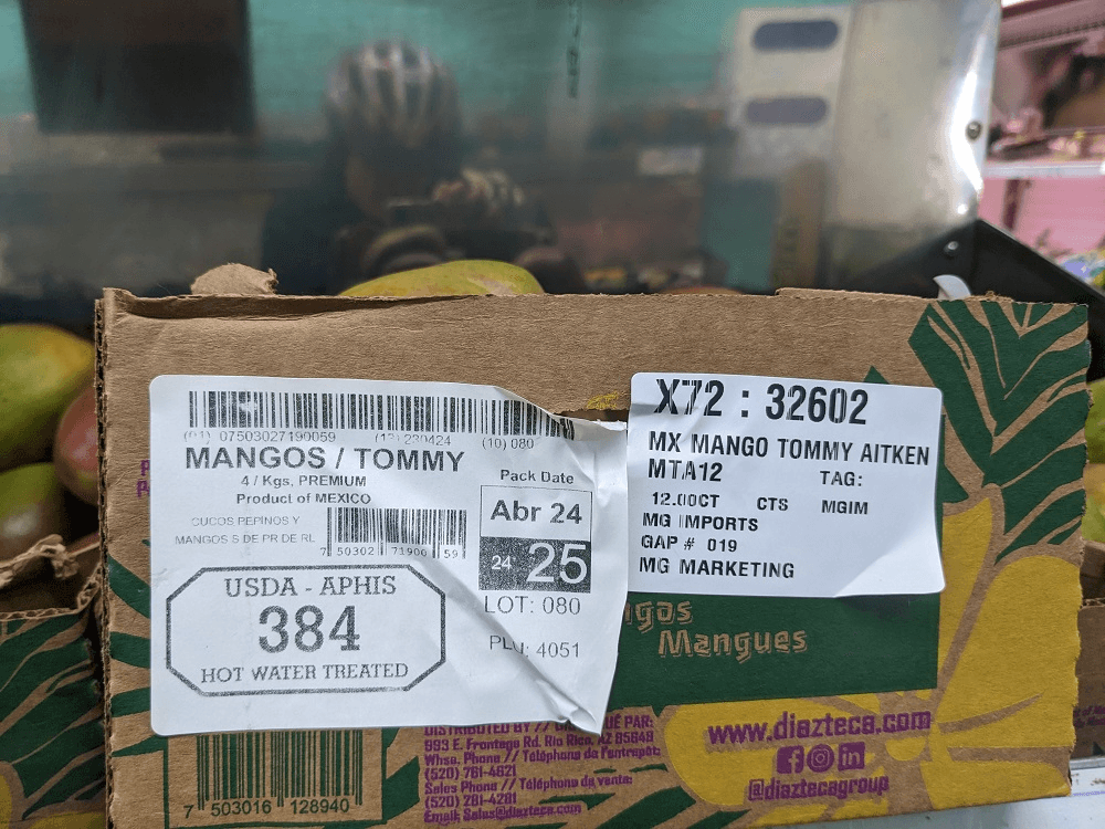 label on a box of tommy atkins mangoes showing that they have been heat treated