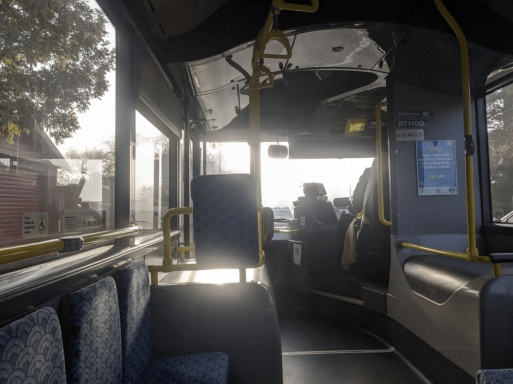 the inside of a bus, morning light
