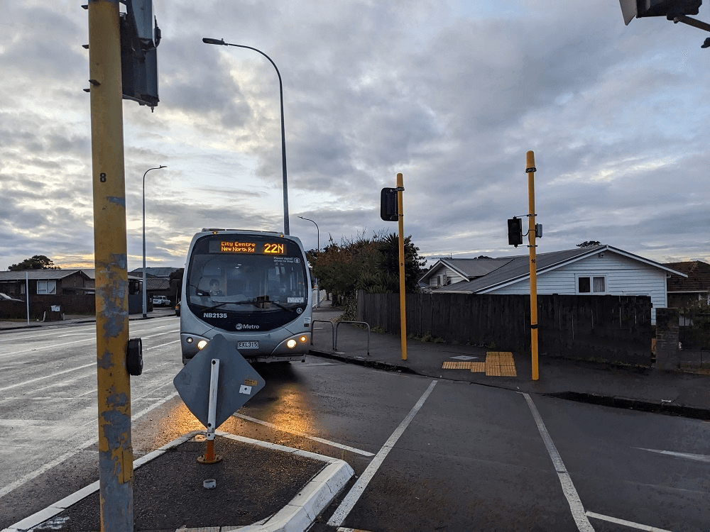 a bus in the evening turning the corner